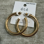 A pair of gold basic hoops.