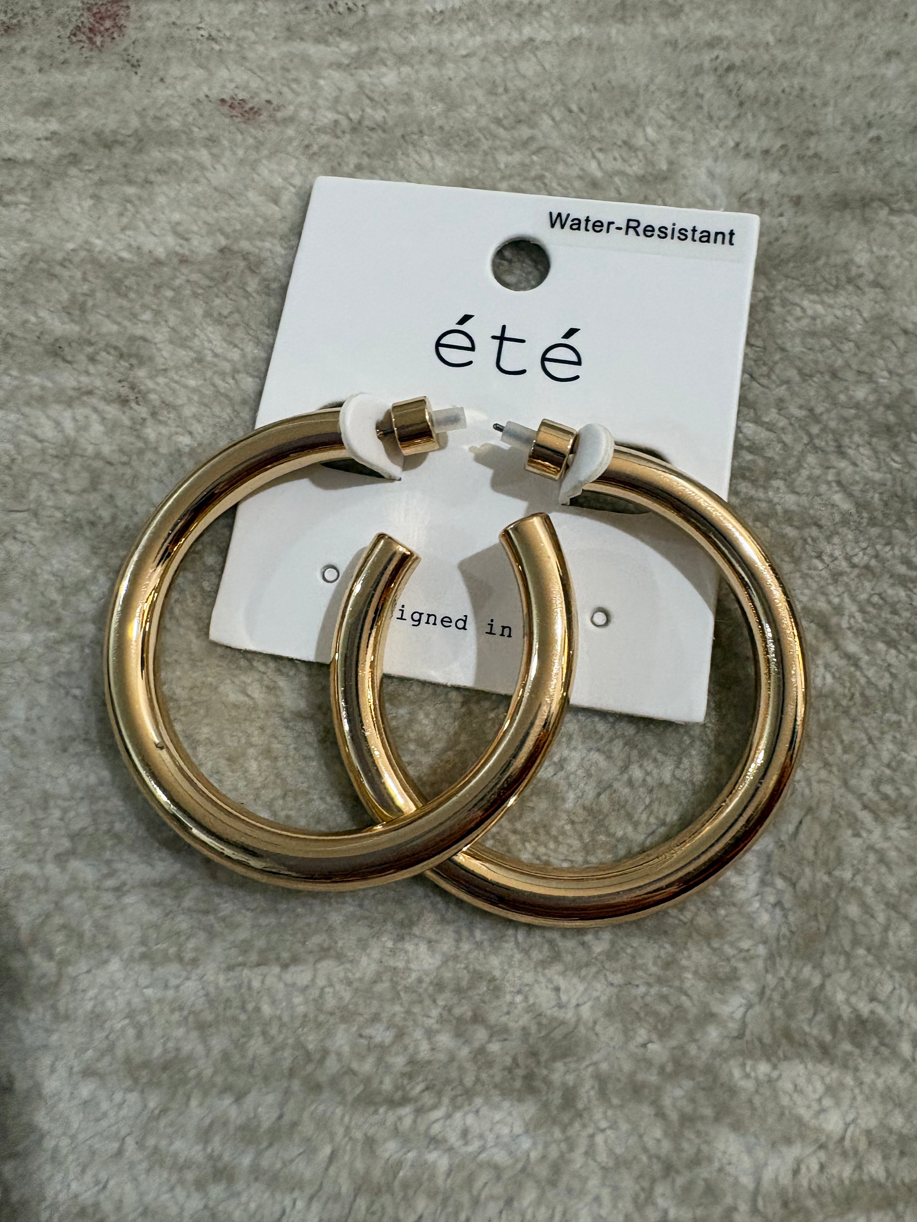 A pair of gold basic hoops.