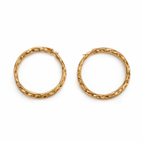 A pair of gold hoop earrings on a white background