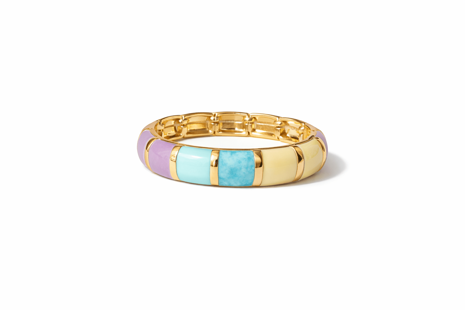Gold bracelets  with colorful inlay on a white background