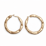 A pair of gold hoop earrings on a white background