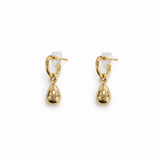 A pair of gold teardrop earrings on a white background