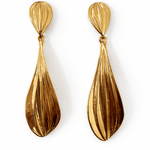 A pair of gold drop down earrings.