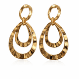 Gold hoop earrings on a white background.