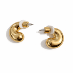 A pair of small gold hoop earrings with white centers on a white background.