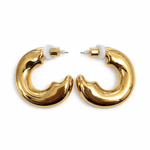 Gold hoop earrings on a white background
