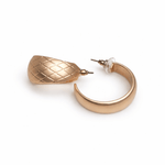 Gold hoop earrings on a white background.