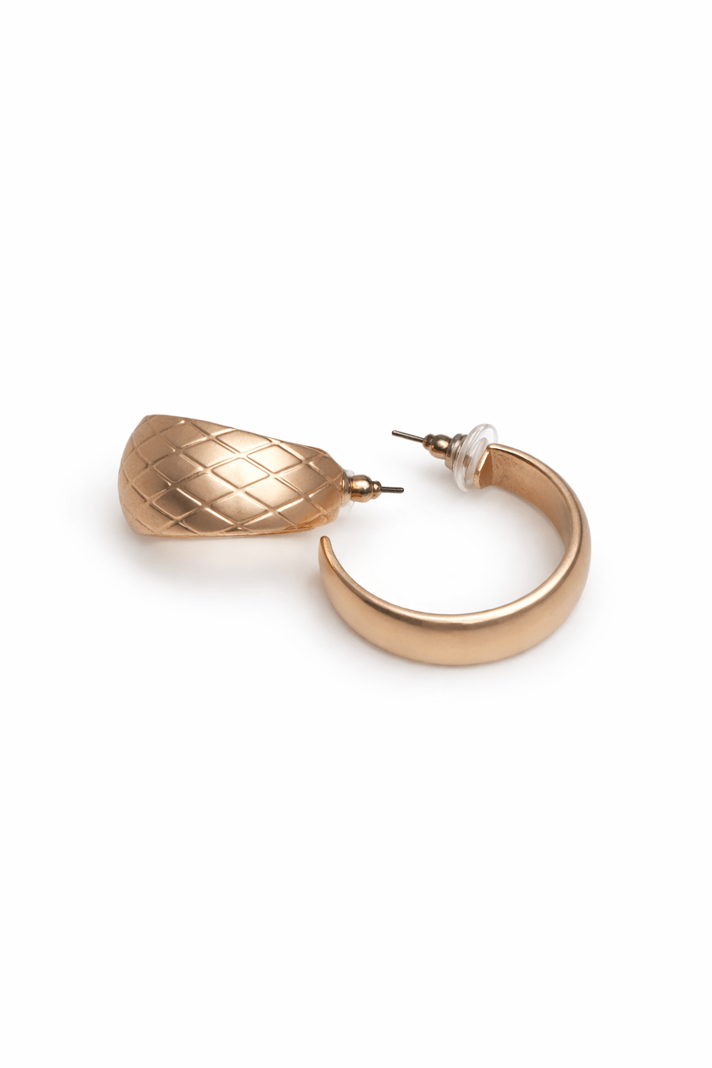 Gold hoop earrings on a white background.
