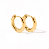 Gold hoop earrings on a white background