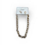 Gold chain necklace and earrings on a white background.