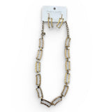 Necklace and earrings set on a white background