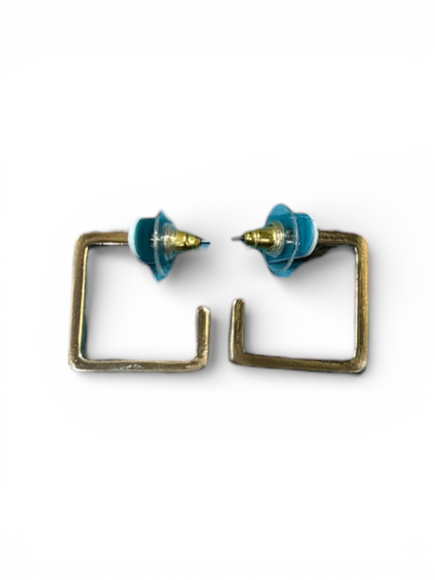 Pair of earrings with square frames and blue tops on a white background