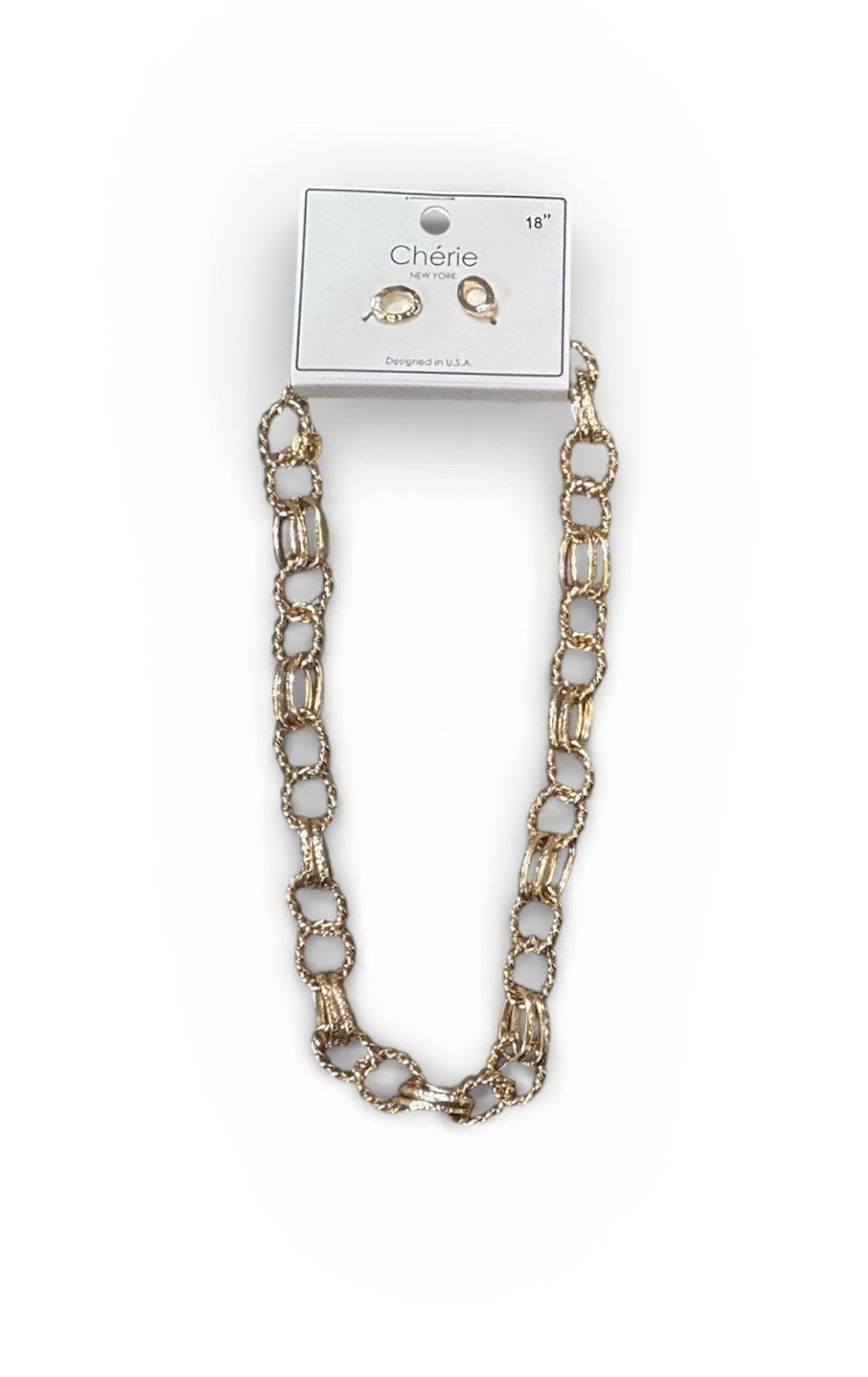 Gold chain necklace on a white background with a card displaying earrings.
